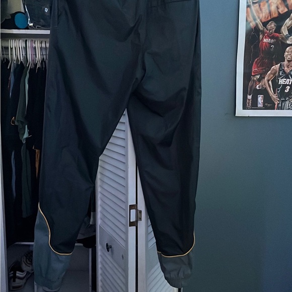 Jordan Joggers, color black with yellow detailing, it is a size small. - Picture 2 of 5